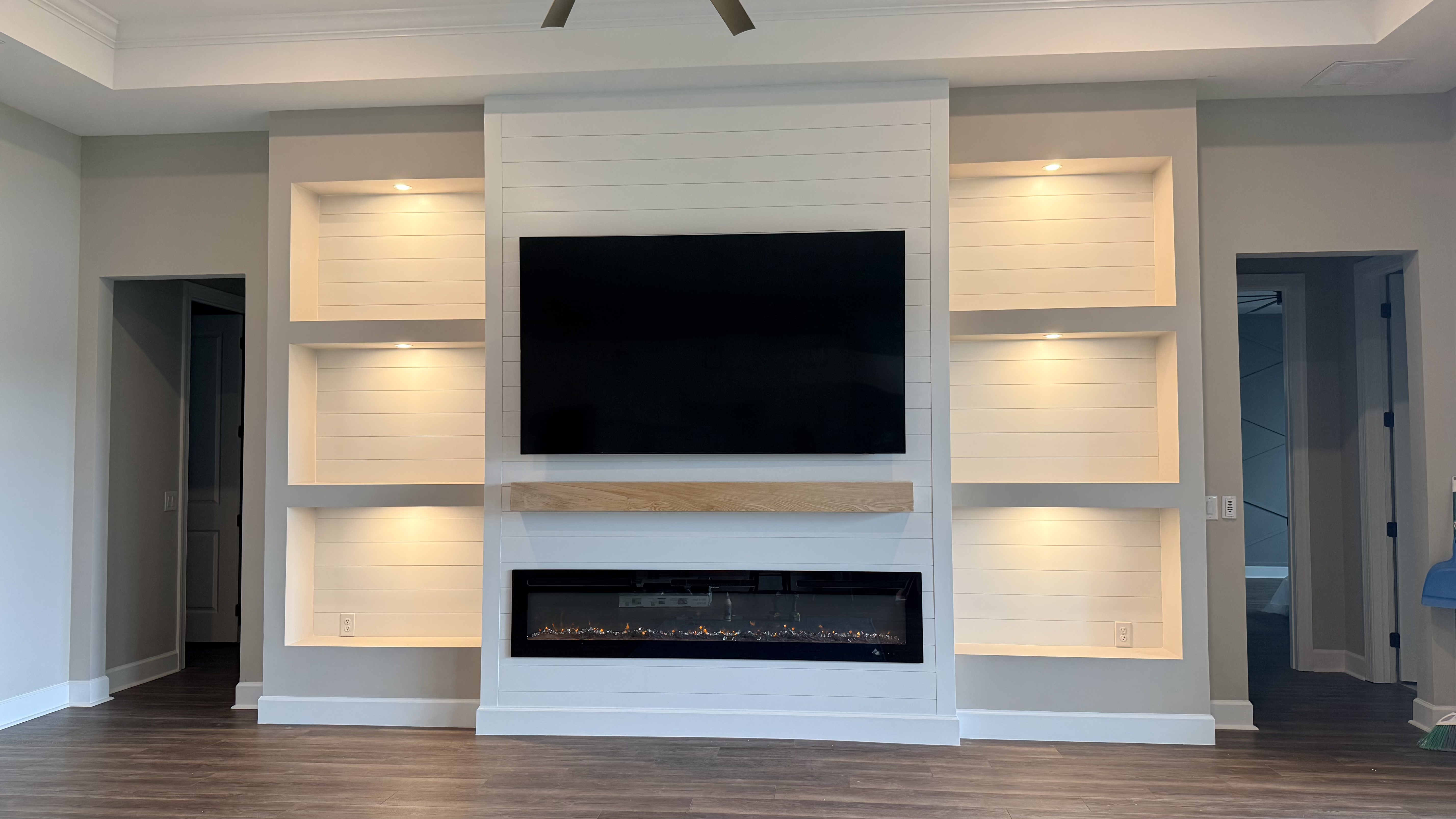 Modern entertainment wall with floating TV and accent lighting