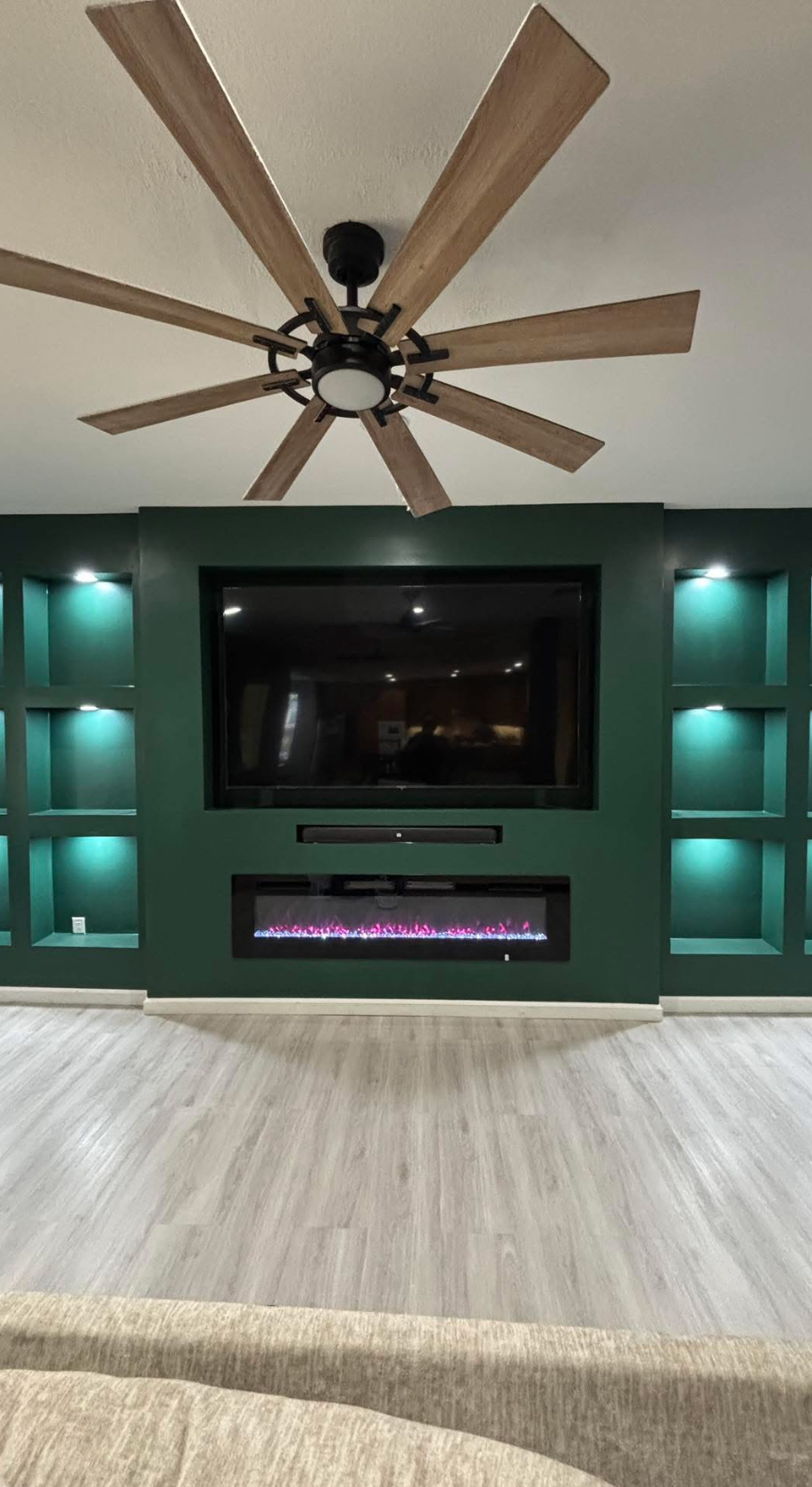 Modern TV wall with fluted panels and integrated lighting