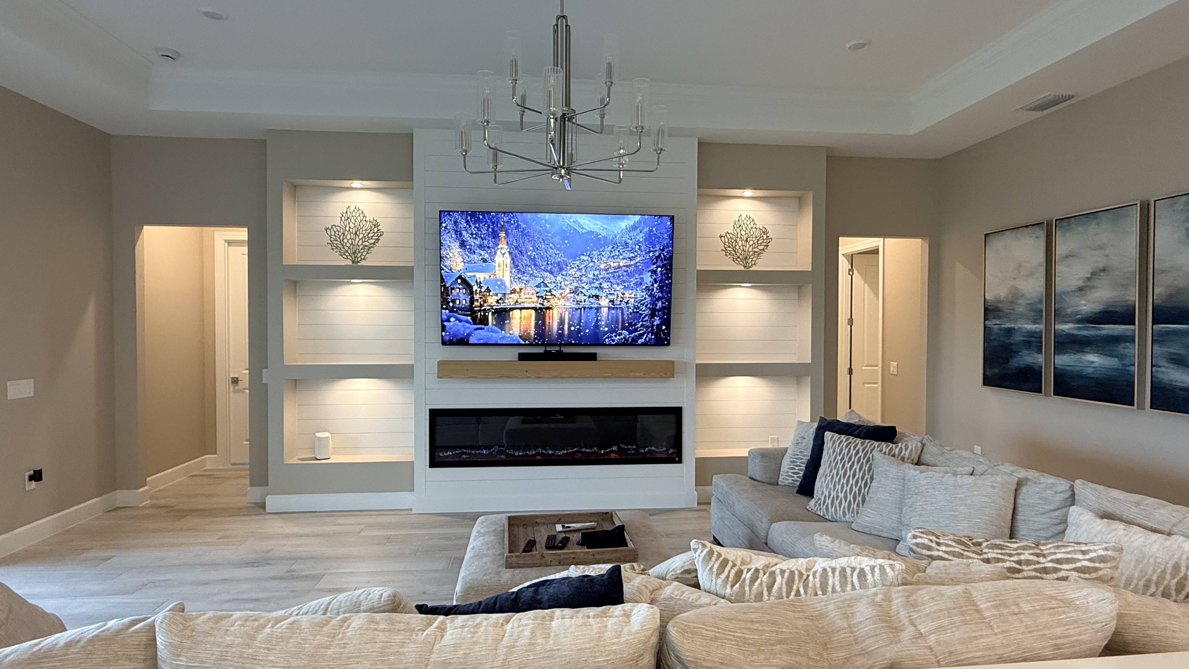 Custom entertainment wall with fireplace and decorative panels
